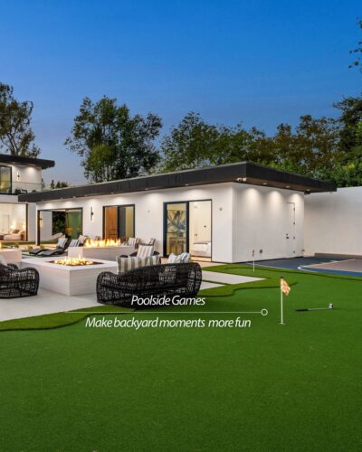 Luxury backyard in North Texas featuring poolside putting green and firepit by Zodiac Pools & Outdoor Living.